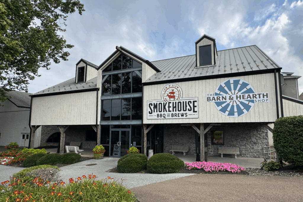 Exterior of Plain & Fancy Building in Lancaster PA with Smokehouse & Barn and Hearth Signs